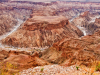 “Panoramisch uitzicht over de Fish River Canyon in Namibië, een van de grootste canyons ter wereld.”