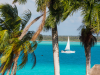 Bacalar Zeilboot - “Zeilboot op turquoise water van de Bacalar-lagune.”