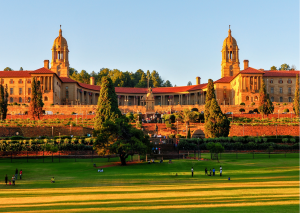 “Het statige Uniongebouw in Pretoria met uitzicht over de stad en omliggende tuinen.”